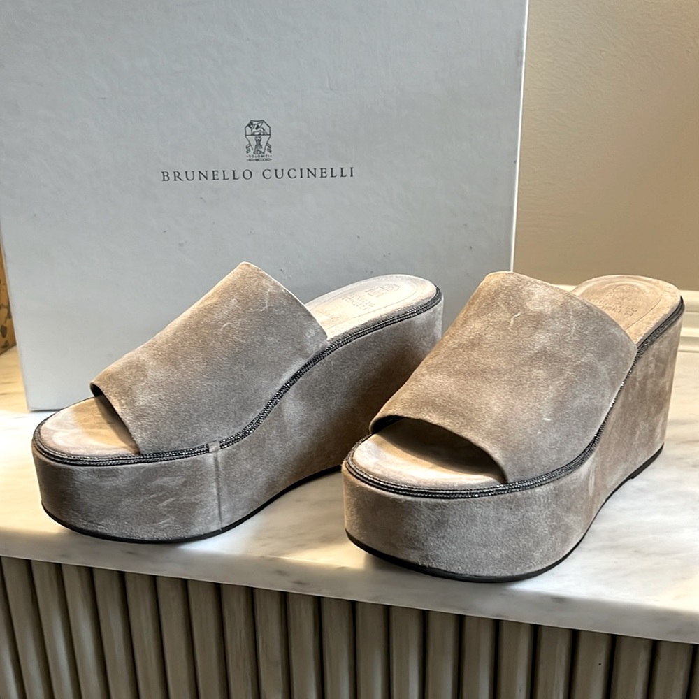 Excellent condition. Never worn platform suede sandals